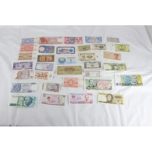 402 - A lot of assorted foreign bank notes from Latvia, Korea, Indonesia, Costa Rica, Bhutan, Burma, Belar... 