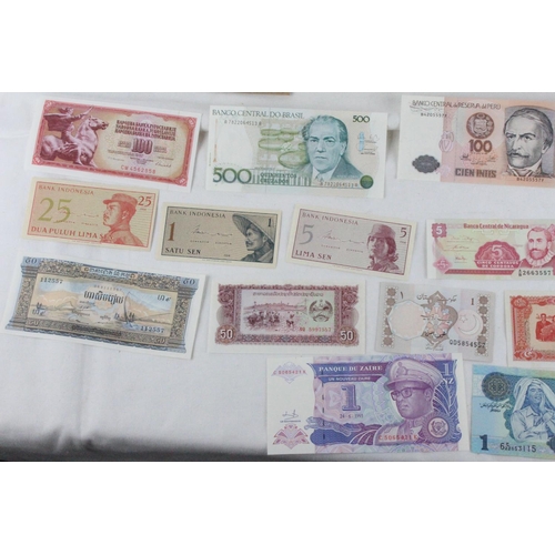 406 - A lot of assorted foreign bank notes from Cambodia, Loas, Latvia, Peru, Indonesia, Ukraine, Ecuador,... 