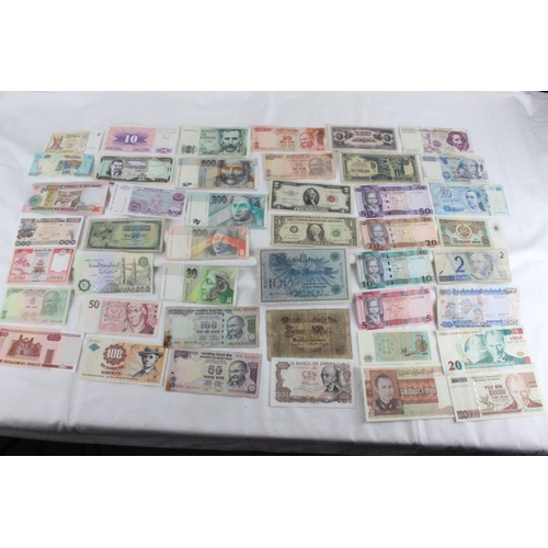 408 - A lot of assorted foreign bank notes from Turkey, Brazil, Tunisia, Italy, Spain, Japan, Denmark, Ger... 