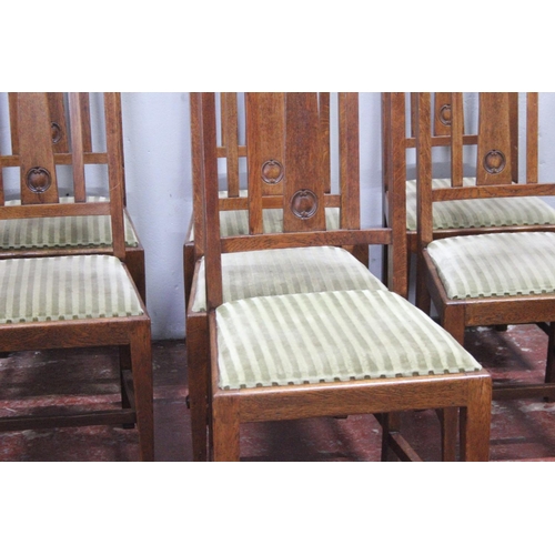 9 - A set of seven antique oak dining room chairs.