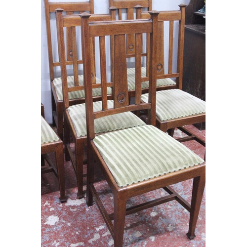 9 - A set of seven antique oak dining room chairs.