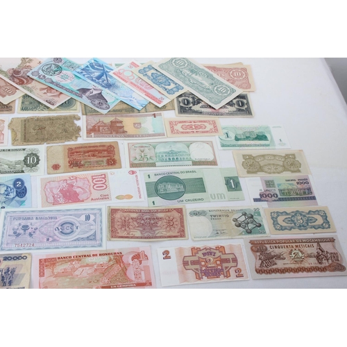 101 - A large quantity of foreign bank notes including Japan, India, Romania, Germany, Greece and more.