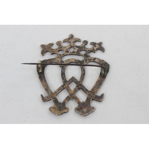 92 - A large antique white metal Scottish Luckenbooth brooch with engraved detail.