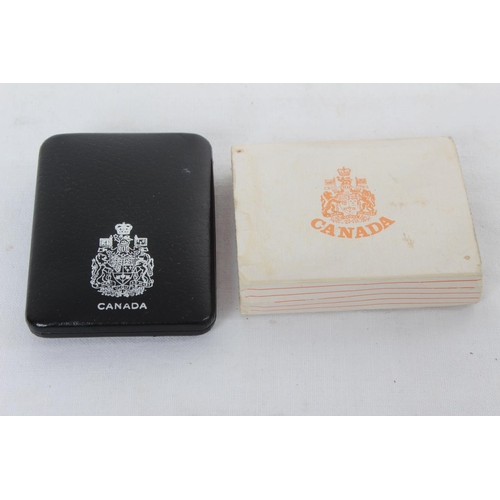 93 - A Canadian one dollar proof coin in presentation case and sleeve.