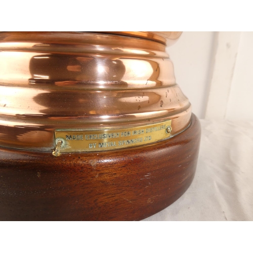 116 - A large 'Hot Irish Whiskey' copper samovar with decorative brass handles and tap, mounted on wooden ... 