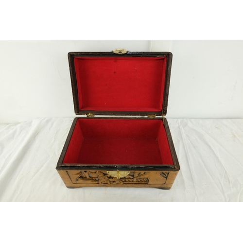 154 - A carved oriental style jewellery box.