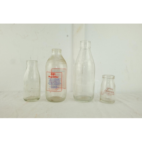 160 - A vintage Cow & Gate Cream glass bottle and three others.