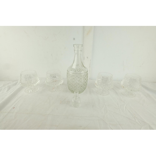 163 - A vintage pressed glass decanter and four crystal brandy glasses.