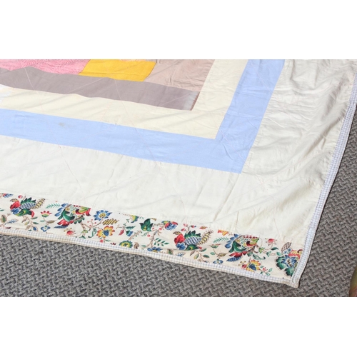 168 - A vintage Irish handmade patchwork throw by quilter Kate McCarry from Ballycastle, measuring 204cm x... 