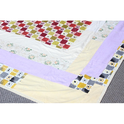 169 - A vintage Irish handmade patchwork throw by quilter Kate McCarry from Ballycastle, measuring 192cm x... 