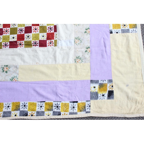 169 - A vintage Irish handmade patchwork throw by quilter Kate McCarry from Ballycastle, measuring 192cm x... 