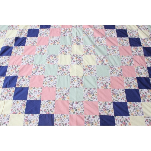 173 - A vintage Irish handmade patchwork throw with cut corner design, measuring 230cm x 169cm.