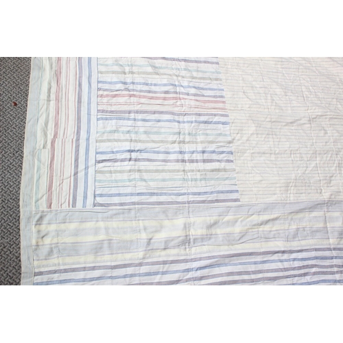 174 - An antique Irish handmade patchwork throw, double sided made from shirt material, measuring 208cm x ... 