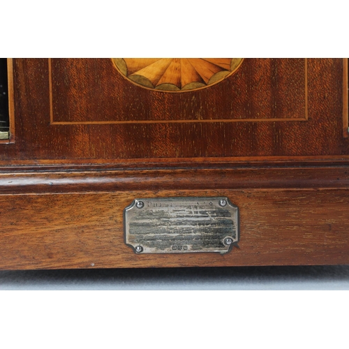 176 - A stunning antique mahogany and inlay arched shaped mantle clock with presentation plaque.