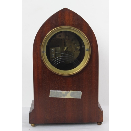 176 - A stunning antique mahogany and inlay arched shaped mantle clock with presentation plaque.