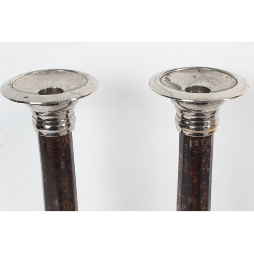 192 - A large par of silver plated candlesticks with metal columns, each measuring 38cm tall.