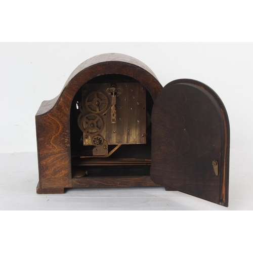 215 - A vintage wood cased mantle clock.