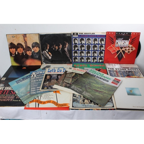 217 - A collection of vintage records/albums including The Beatles, Kiss, Sting, With the Beatles, The Sto... 