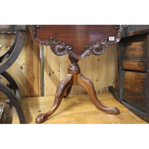 223 - A stunning antique/ Georgian style mahogany tip over leaf breakfast table on a tripod base with carv... 