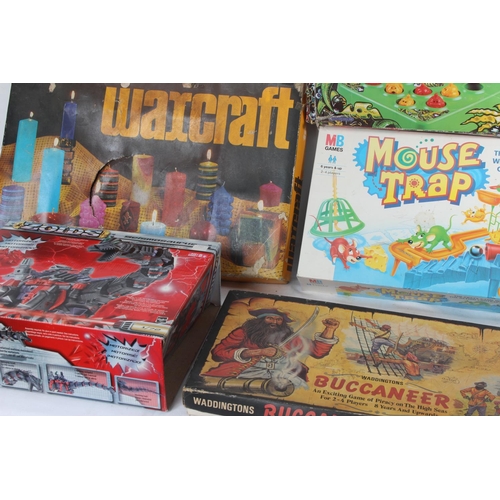 234 - A collection of vintage board games including Draughts, Buccaneer and more.