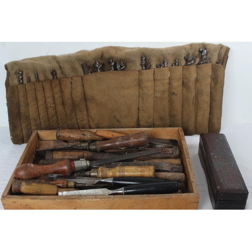 242 - A large lot of vintage drill bits in a tool roll, and a wooden tray of assorted chisels and a wooden... 