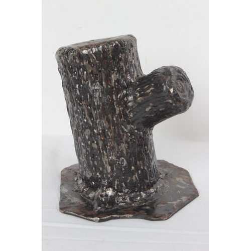 256 - A large cast metal tree stump door stop along with a handmade double candlestick.