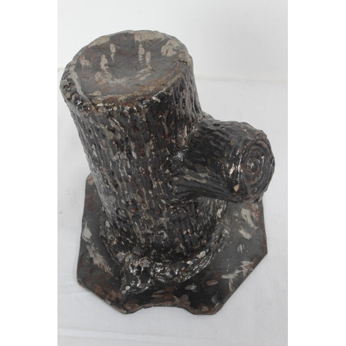 256 - A large cast metal tree stump door stop along with a handmade double candlestick.