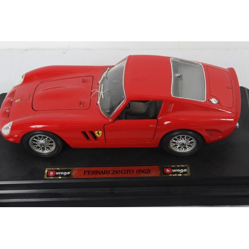 258 - A Burago 'Ferrari 250 GTO 1962' collectors car, a diecast Minichamps Formula 1 car and two others.