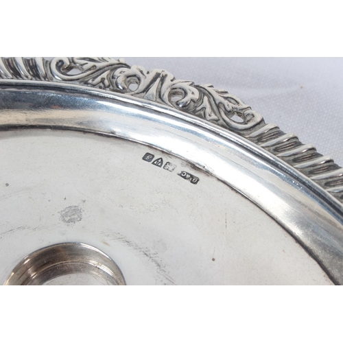 377 - A Sterling Silver Candlestick with decorative banded rim, fully hallmarked for Chester, weighing 107... 