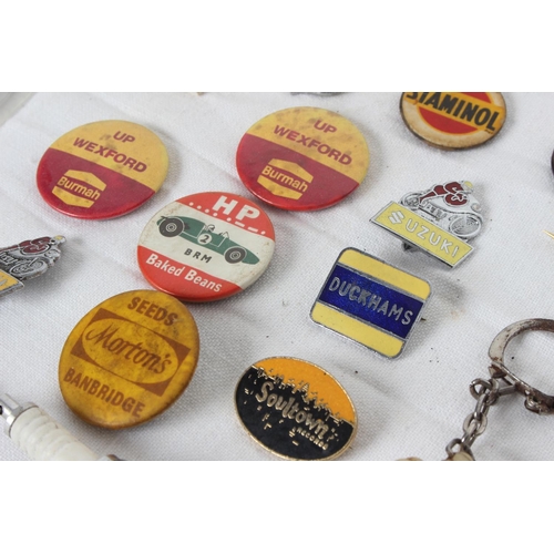 379 - A collection of vintage Automobilia/ advertising enamel badges & more.