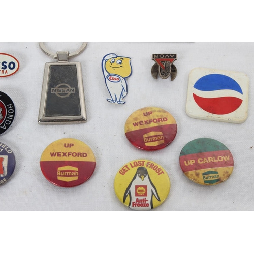 380 - A collection of vintage Automobilia/ advertising enamel badges & more.