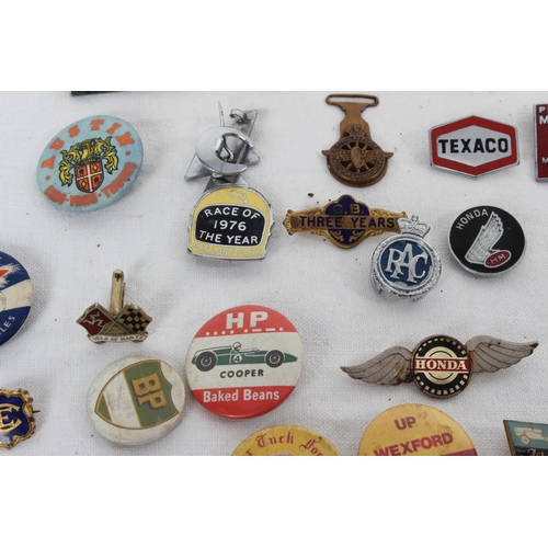 380 - A collection of vintage Automobilia/ advertising enamel badges & more.