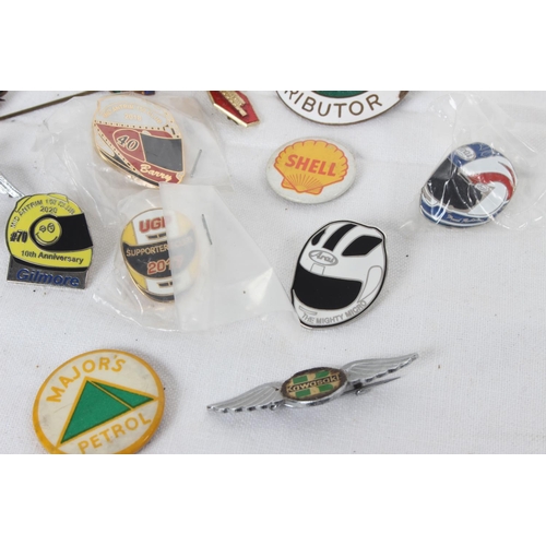 381 - A collection of vintage Automobilia/ advertising enamel badges & more.