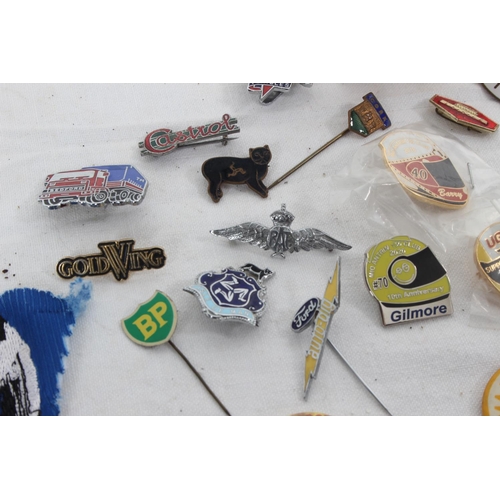 381 - A collection of vintage Automobilia/ advertising enamel badges & more.