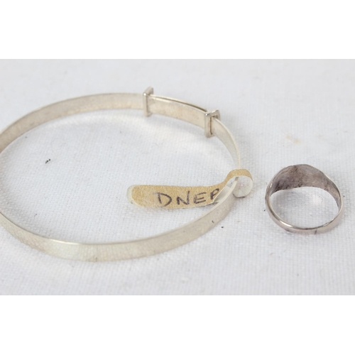 386 - A Sterling Silver baby bangle & heart shaped signet ring.