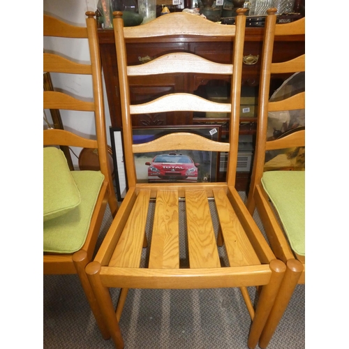 451 - A set of 4 Mid Century Ercol ladder back dining chairs.