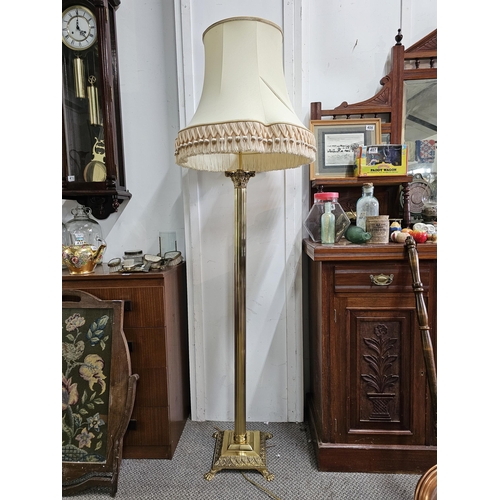 411 - A stunning antique brass standard lamp with lion paw feet base & Corinthian pillar top (shade a/f).