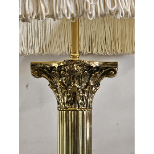 411 - A stunning antique brass standard lamp with lion paw feet base & Corinthian pillar top (shade a/f).