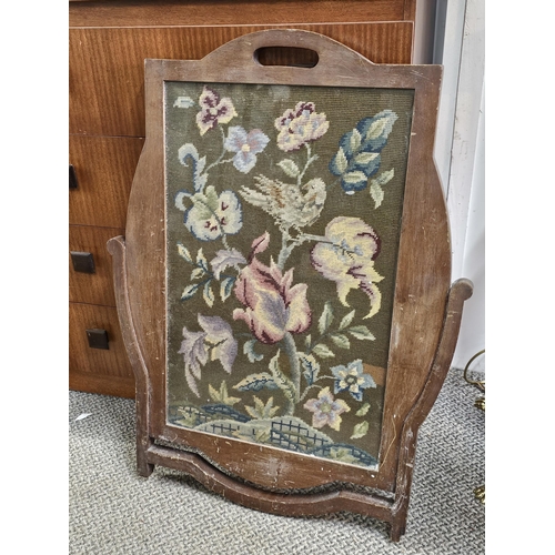 413 - A decorative antique oak framed needlepoint tapestry.