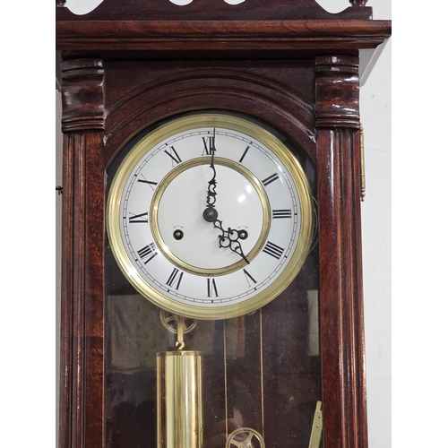 418 - A stunning double weight Vienna wall clock, measuring 115cm.