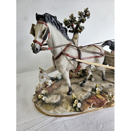 429 - A stunning large Capodimonte figure showing a horse with Jaunting car & Couple, some damage to petal... 