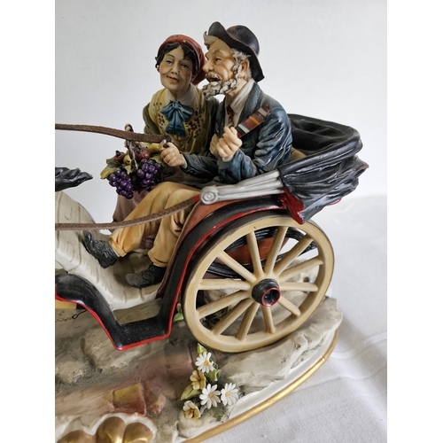 429 - A stunning large Capodimonte figure showing a horse with Jaunting car & Couple, some damage to petal... 