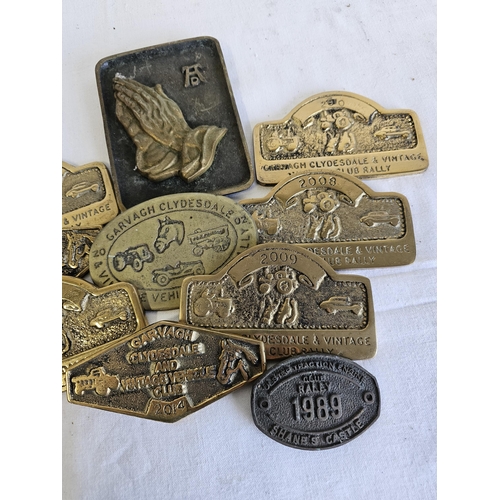 465 - A collection of vintage brass rally plaques.