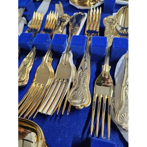 497 - A stunning canteen of gold plated Kings pattern cutlery, in coffee table canteen.