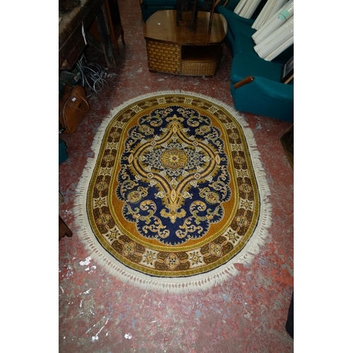 355 - A large decorative Axminster rug, measuring 198x138cm.