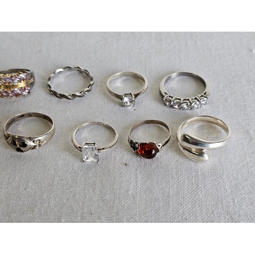 371 - A collection of 10 silver dress rings.