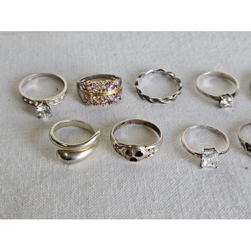 371 - A collection of 10 silver dress rings.