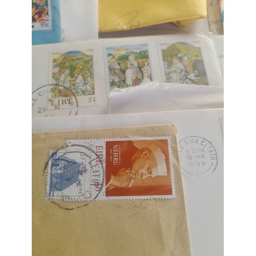 454 - A very large lot of used postage stamps from around the world, including Hong Kong, Ireland, USA, Ca... 