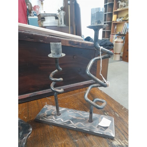 256 - A large cast metal tree stump door stop along with a handmade double candlestick.