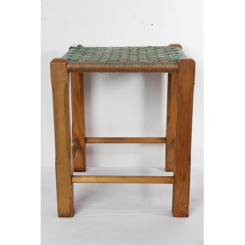 166 - A vintage rattan topped stool. 40x34cm